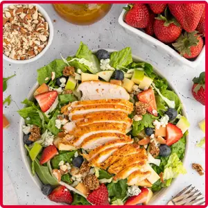 “Chick-fil-A Market Salad made with fresh mixed greens, grilled chicken, apples, strawberries, blueberries, granola and blue cheese with apple cider vinaigrette.”