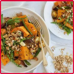 “Assorted sides including fries, fruit cups, and other tasty accompaniments.”