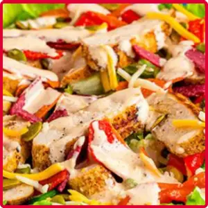 “Chick-fil-A Spicy Southwest Salad made with sliced spicy grilled chicken, mixed greens, black beans, corn, tomatoes, chili lime pepitas and creamy salsa dressing.”